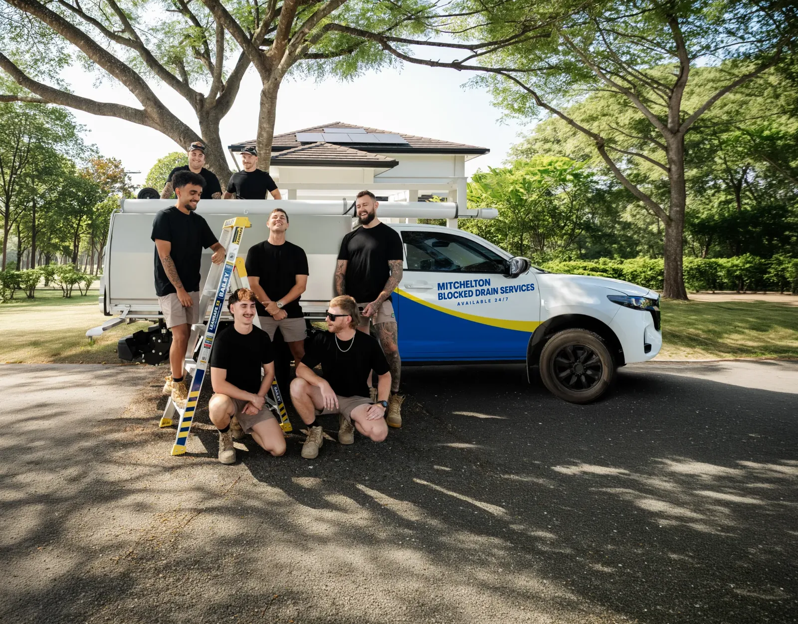 Mitchelton Blocked Drain Services ute and team